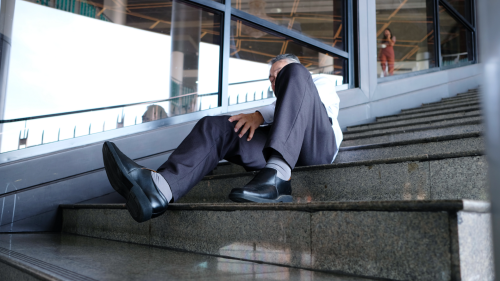 Man injured on stairs showing slip and fall accident for Florida negligence case